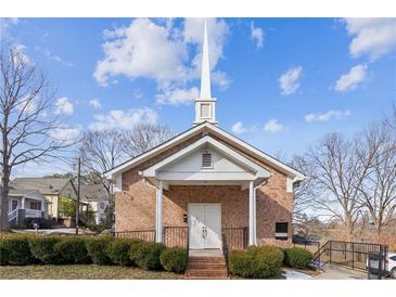 Brick church with steeple, landscaping, and steps at 193 Gibson St, Atlanta, GA 30316