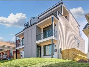 Modern two-story home featuring a gray exterior with black trim and balconies on the upper floors at 337 Pine Ne St # A, Atlanta, GA 30308