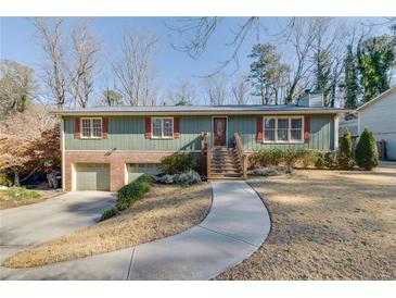 Ranch style home with attached garage and landscaped yard at 2500 Cottonwood Dr, Marietta, GA 30066