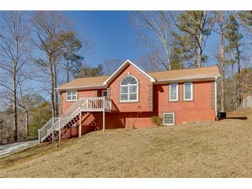 Ranch style home with deck and wooded lot at 180 Paces Lakes Pointe St, Dallas, GA 30157