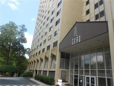 High-rise building exterior with entrance and landscaping at 2479 Peachtree Ne Rd # 1103, Atlanta, GA 30305