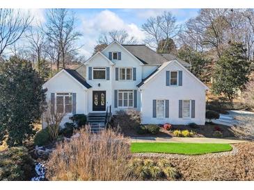 Two story house with gray shutters and white brick exterior at 1160 Lea Dr, Roswell, GA 30076