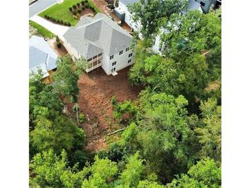 Aerial view of a new house and surrounding community, showcasing the neighborhood's landscape at 4412 Brookview Se Dr, Atlanta, GA 30339