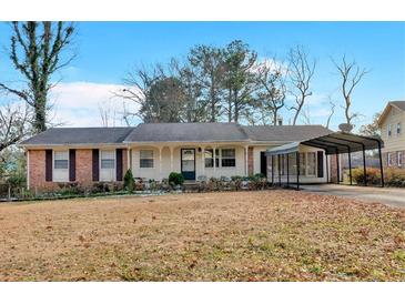 Brick ranch house with carport and spacious yard at 2401 Prestige Valley Ct, Morrow, GA 30260