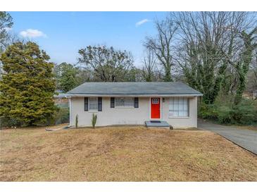 Charming ranch home with red front door and well-maintained lawn at 37 Delmoor Nw Ct, Atlanta, GA 30311