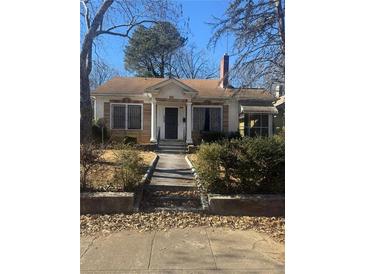 Charming brick home with a classic design and well-maintained landscaping at 1423 Graham Sw St, Atlanta, GA 30310