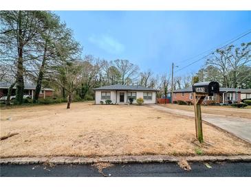 Ranch style home with a spacious yard at 3693 Aldea Dr, Decatur, GA 30032