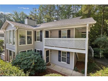 Charming two-story home with covered porch and well-maintained landscaping at 1608 Vicksburg Pl, Sandy Springs, GA 30350
