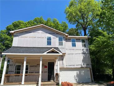 Two-story house with gray siding, a white front door, and a covered porch at 363 Marigna Ave, Scottdale, GA 30079