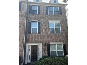 Charming multi-story brick home with black shutters and a welcoming front entrance at 743 Pecan Knoll Dr # 5, Marietta, GA 30008