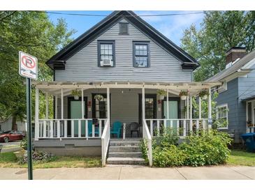 Gray duplex with white porch, teal chairs, and landscaping at 607 Gaskill Se St, Atlanta, GA 30316