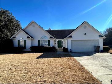 Charming one-story house with a large front yard and attached two-car garage at 11 Triplet Trl, Douglasville, GA 30134