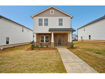 Charming two-story home with stone accents, covered entryway, and well-maintained lawn at 1260 Firefly Field Trce Trce, Lawrenceville, GA 30045
