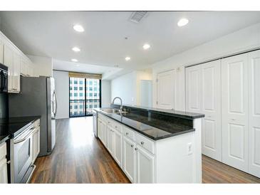 Modern kitchen with stainless steel appliances and granite countertops at 3040 Peachtree Rd # 802, Atlanta, GA 30305