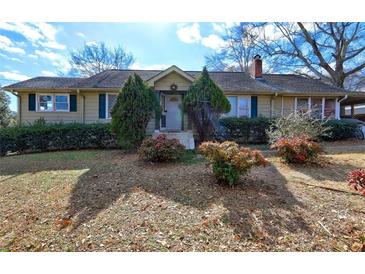 Ranch style home with mature landscaping and a spacious yard at 141 Hill St, Roswell, GA 30075