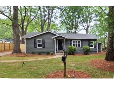 Charming single-story home with a well-maintained lawn and inviting curb appeal at 1929 Hazelwood Se Dr, Marietta, GA 30067