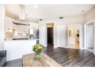 Modern kitchen with stainless steel appliances and white cabinetry at 2626 Peachtree Nw Rd # 706, Atlanta, GA 30305