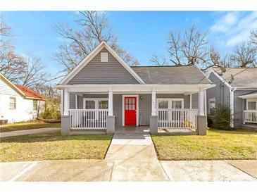 Gray craftsman style home with a red front door and porch at 1091 Longley Nw Ave, Atlanta, GA 30318