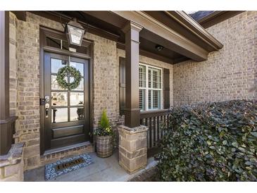 Charming brick home entrance featuring a stylish door with a decorative wreath at 4532 Summersweet Dr, Marietta, GA 30066