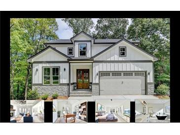 Beautiful two-story home with a two-car garage, stone accents, and a welcoming entrance at 7650 Abbey Glen Dr, Cumming, GA 30028