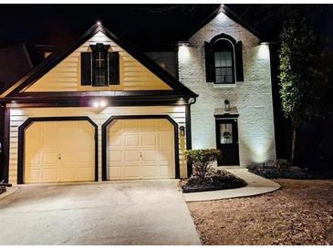 Stunning two-story home with a two-car garage and updated exterior lighting at 2587 Alvecot Cir, Atlanta, GA 30339