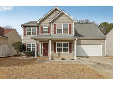 Two-story house with gray siding, red shutters, and a two-car garage at 1236 Key Manor Ln, Lawrenceville, GA 30045