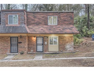 Brick townhouse with a charming front entrance and mature trees at 11 Peyton Sw Pl, Atlanta, GA 30311