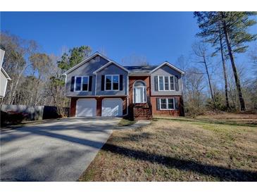 Charming two-story home with a well-manicured front yard and attached two car garage at 3640 Autumn View Nw Dr, Acworth, GA 30101