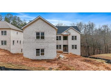 Two-story brick home under construction, showcasing a modern design and spacious layout at 4267 Matisse Ln, Fairburn, GA 30213