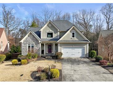 Two-story house with stone accents and a large driveway at 2669 Glenrose Hl, Atlanta, GA 30341