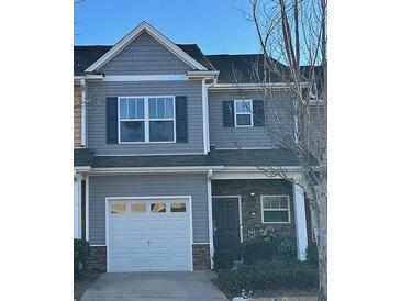 Gray townhome with white garage door and stone accents at 532 Oakside Pl, Acworth, GA 30102