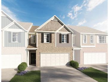 Two-story brick home with gray accents and a two-car garage at 573 Cygnet Ln, Grayson, GA 30017