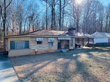 Ranch style home with carport and mature trees at 4350 Rockdale Dr, Acworth, GA 30101