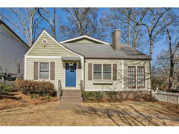 Charming craftsman home with a blue door and well-manicured lawn at 2590 Knox Ne St, Atlanta, GA 30317