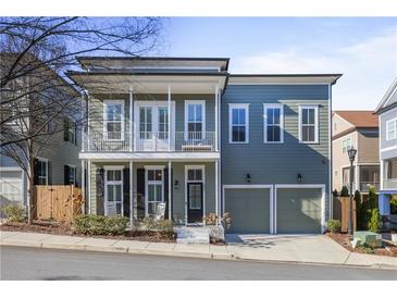 Two-story craftsman style home with front porch and two-car garage at 393 Summerhour St, Marietta, GA 30060