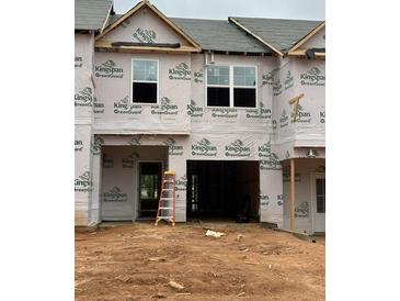 New construction townhome featuring a garage and covered entry, ready for customization at 2812 Lillian Ln, Douglasville, GA 30135