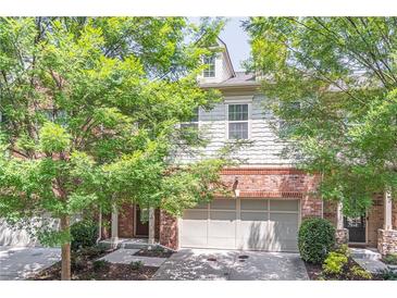 Brick front exterior of charming townhome with two-car garage at 822 Northam Ln, Atlanta, GA 30342