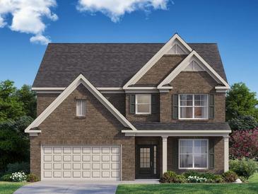 Two-story brick home with a three-car garage and landscaping at 7175 Linden Dr, South Fulton, GA 30349