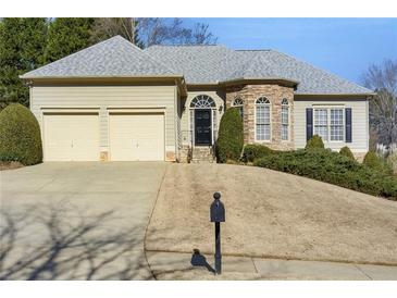 Two-story house with stone accents and a two-car garage at 200 Holly Chase Ct, Canton, GA 30114