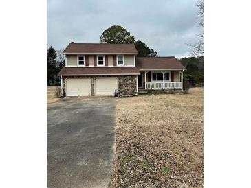 Two-story house with a double garage and a porch at 622 Cloudland Dr, Stockbridge, GA 30281