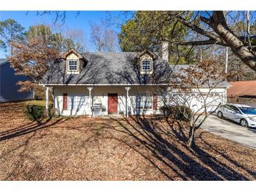 Ranch style home with mature trees and a carport at 390 Wayside Dr, Lawrenceville, GA 30046