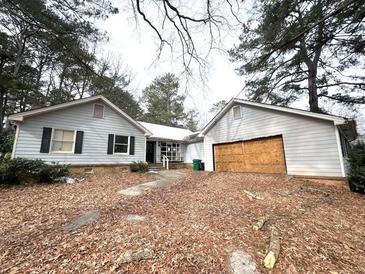 Ranch style home with attached garage needing repairs at 1783 Nicole Ln, Lithonia, GA 30058