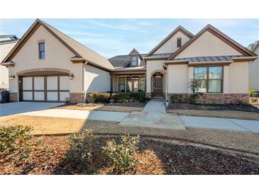 Craftsman style home with stone accents and a 3-car garage at 4983 Kyle Dr, Powder Springs, GA 30127