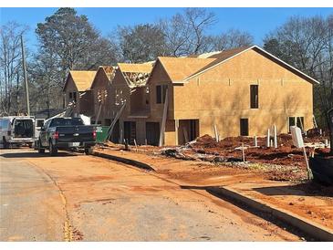 New construction townhomes under development, offering modern designs at 11602 E Lovejoy Rd, Hampton, GA 30228