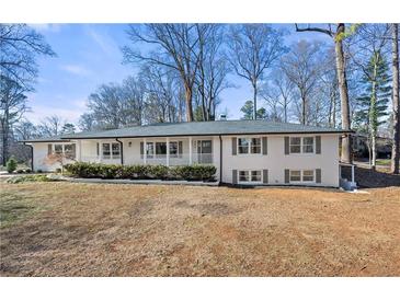 Updated ranch home with gray roof and white exterior, situated on a spacious lot at 380 Atwood Nw Dr, Marietta, GA 30064