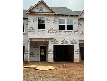 Unfinished townhome exterior showing exposed framing and Kingspan GreenGuard weather-resistant barrier at 2808 Lillian Ln, Douglasville, GA 30135