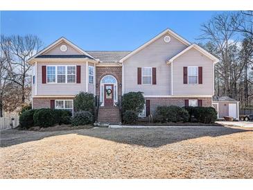 Charming two-story home featuring a brick foundation and red shutters at 230 Cobblestone Ln, Mcdonough, GA 30252