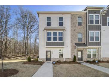 Modern 3-story townhome with white siding and gray accents at 200 Wallace St, Fayetteville, GA 30214