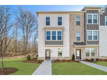 Charming new construction townhome with manicured lawn and tree-lined surroundings at 200 Wallace St, Fayetteville, GA 30214