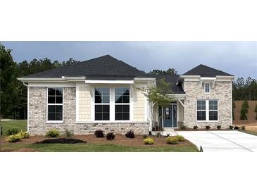 Charming one-story home with brick and siding, well-manicured lawn, and inviting blue door at 15 Cambridge Ln, Dallas, GA 30157